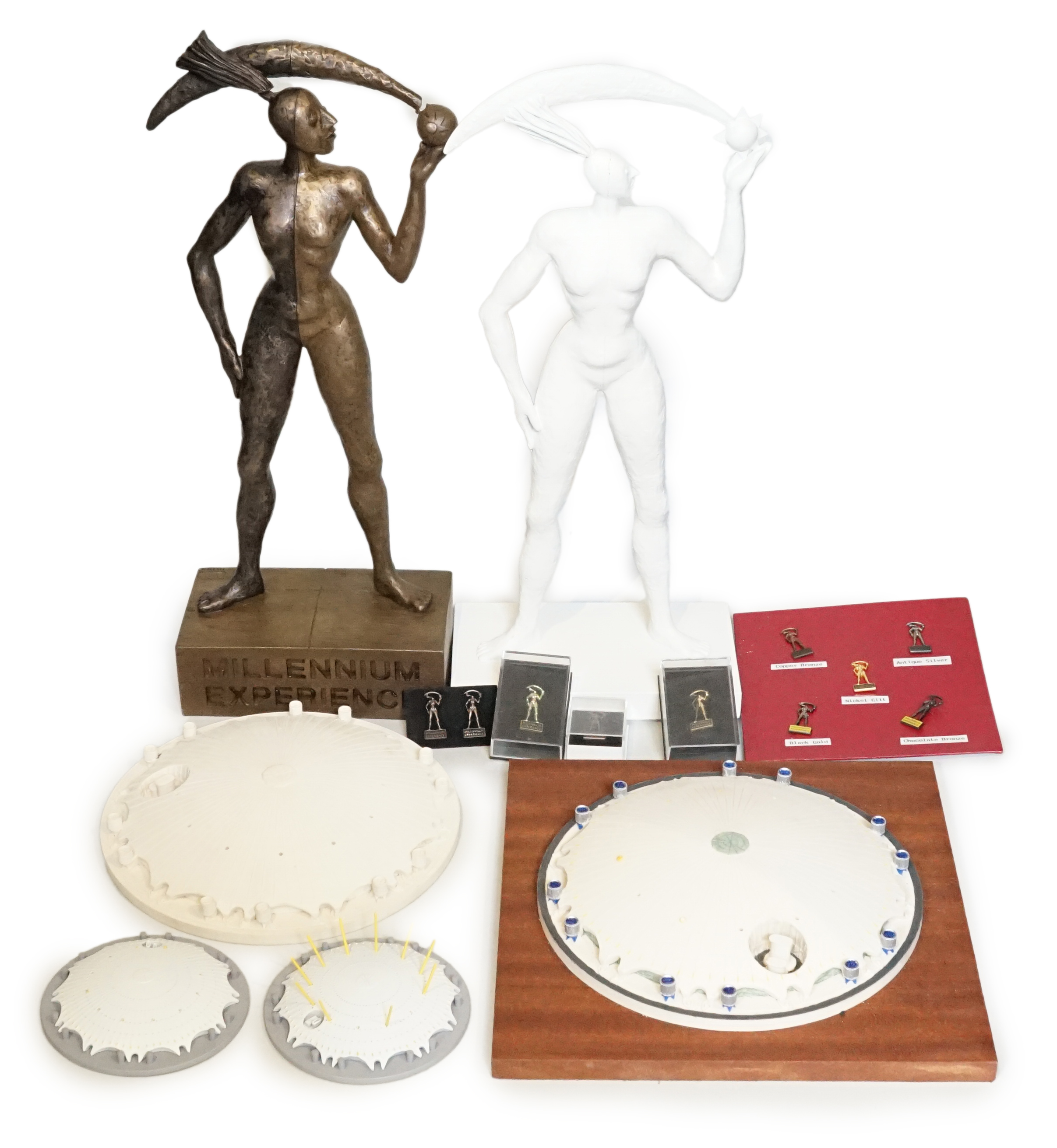 Two prototype diecast Millennium Dome models, other prototype Millennium Dome resin models and two unique Millennium Experience figures for pin development, designed by Mark Reddy, one plaster cast from clay